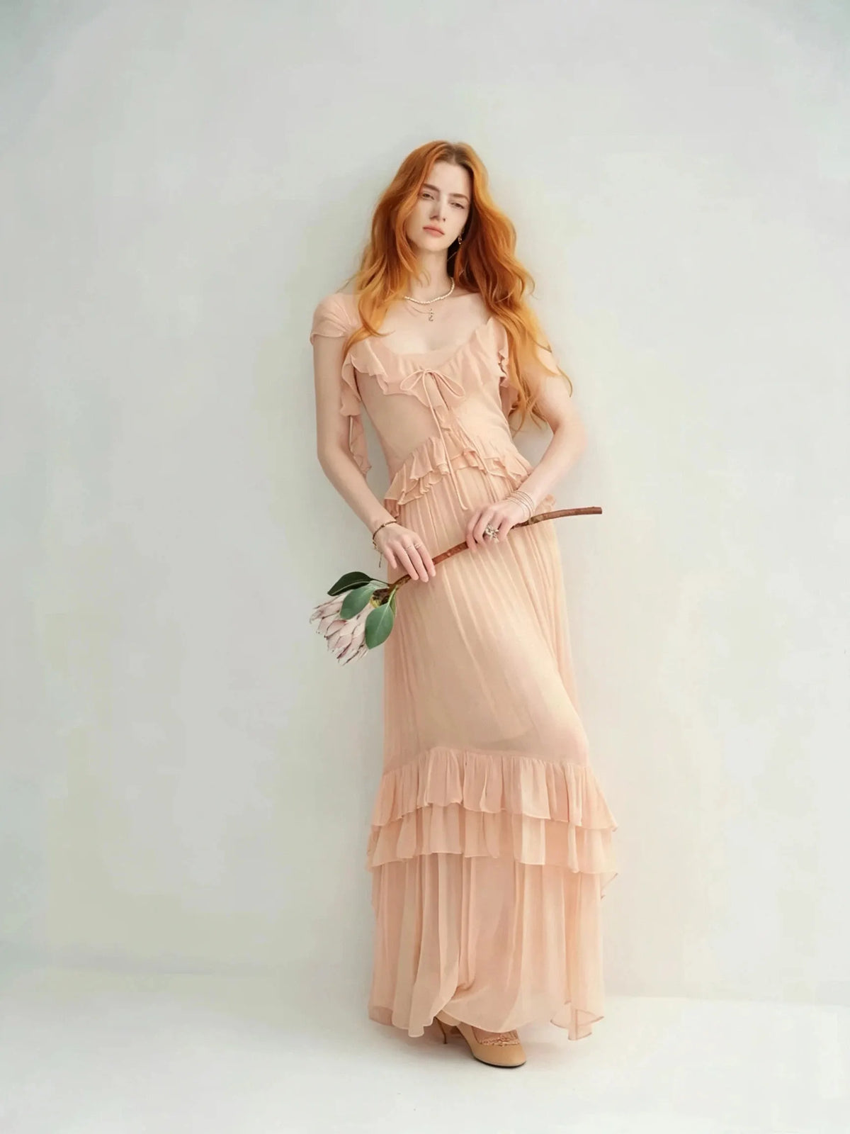 Nude-colored off-shoulder light dress